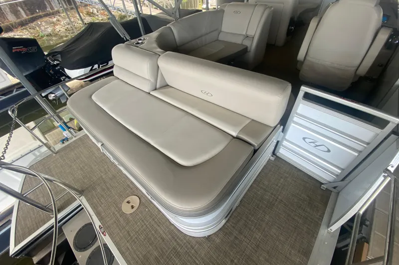 Slide: The Image of 2018 Harris Solstice 240 pontoon boat interior with beige seating and modern design. - 21