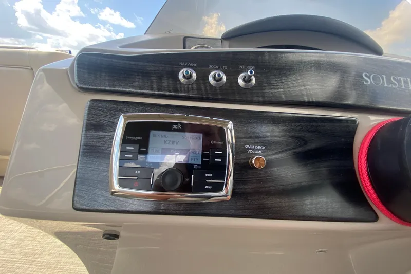 Slide: The Image of Control panel of a 2018 Harris Solstice 240 boat with audio system. - 19