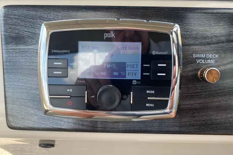 Slide: The Image of Polk audio system on 2018 Harris Solstice 240 boat, displaying 101.9 MHz Soft Rock. - 15