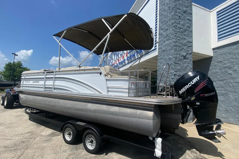 Slide: The Image of 2018 Harris Solstice 240 pontoon boat with Mercury outboard motor on trailer. - 2