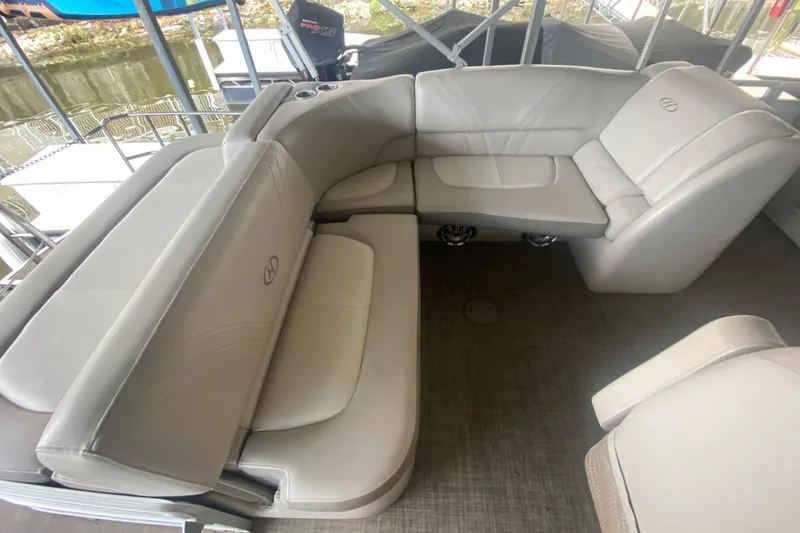 Slide: The Image of Luxurious seating on a 2018 Harris Solstice 240 pontoon boat, featuring plush gray upholstery. - 8