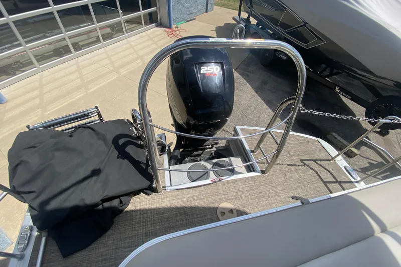 Slide: The Image of 2018 Harris Solstice 240 boat with 250 HP engine, docked outdoors. - 28