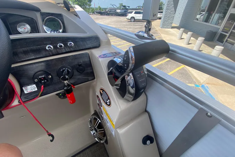Slide: The Image of Control panel of a 2018 Harris Solstice 240 boat, featuring steering and throttle controls. - 20