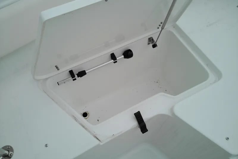 Slide: The Image of Open storage compartment on 2026 Sea Hunt Ultra 235 SE boat. - 10
