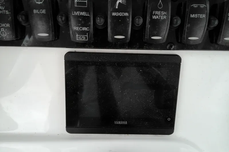 Slide: The Image of Control panel of a 2026 Sea Hunt Ultra 235 SE boat with Yamaha display. - 13