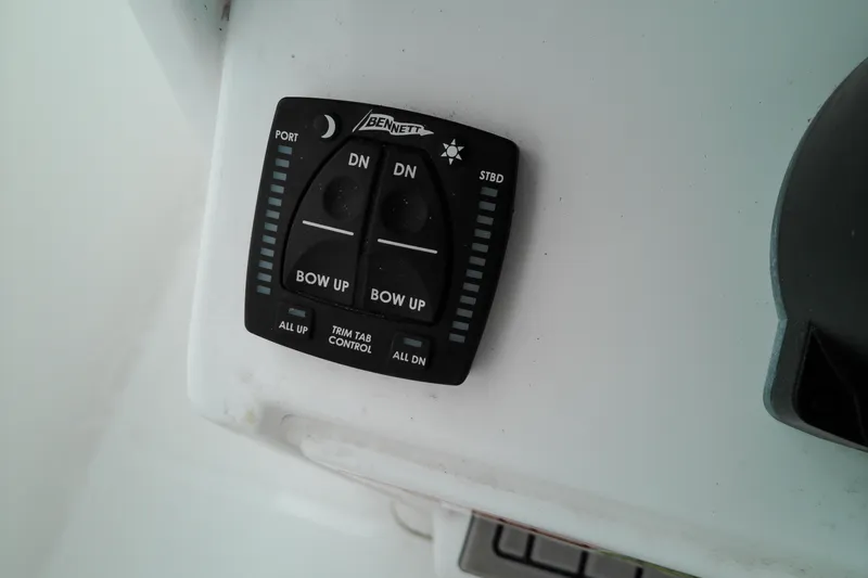 Slide: The Image of Trim tab control panel on 2026 Sea Hunt Ultra 235 SE boat. - 14