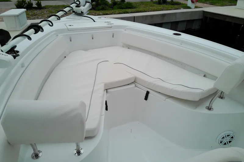 Slide: The Image of 2026 Sea Hunt Ultra 235 SE boat interior with white cushioned seating. - 3