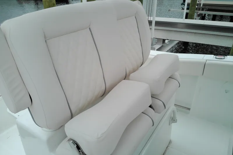 Slide: The Image of Luxury seating on 2026 Sea Hunt Ultra 235 SE boat, featuring plush white upholstery. - 31