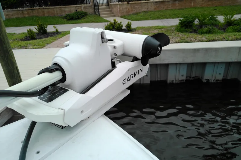Slide: The Image of Garmin marine equipment on 2026 Sea Hunt Ultra 235 SE boat docked by water. - 6