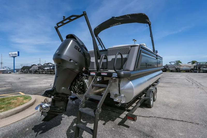 Slide: The Image of 2026 Viaggio Z24U pontoon boat with Suzuki outboard motor on trailer. - 22