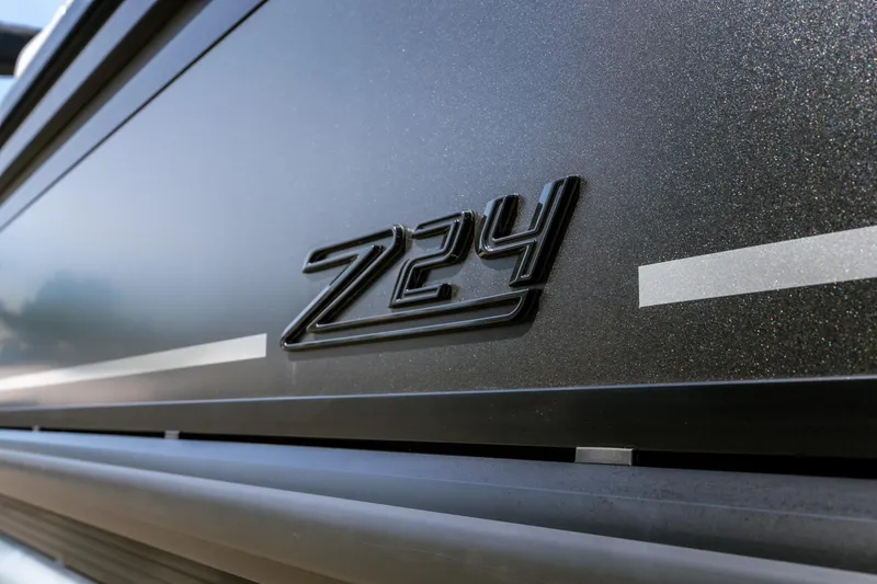 Slide: The Image of Close-up of 2026 Viaggio Z24U model emblem on sleek metallic surface. - 27
