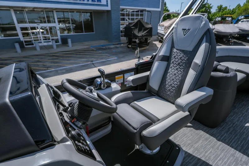 Slide: The Image of Captain's chair and helm of 2026 Viaggio Z24U boat, showcasing modern design and controls. - 14