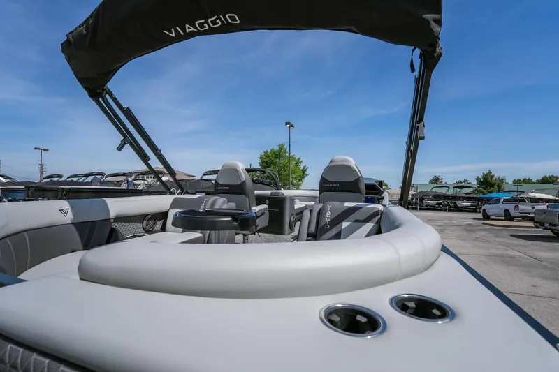 Slide: The Image of 2026 Viaggio Z24U boat interior with seating and canopy under clear blue sky. - 4