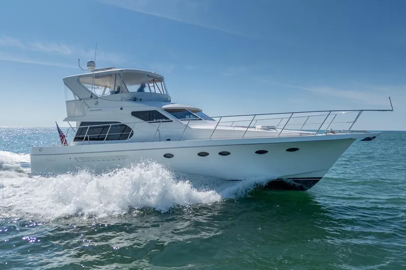 Slide: The Image of 2007 Ocean Alexander 52 Sedan yacht cruising on open water under clear skies. - 1