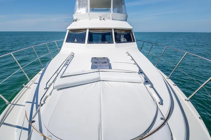 Slide: The Image of 2007 Ocean Alexander 52 Sedan yacht on open sea, sunny day. - 10