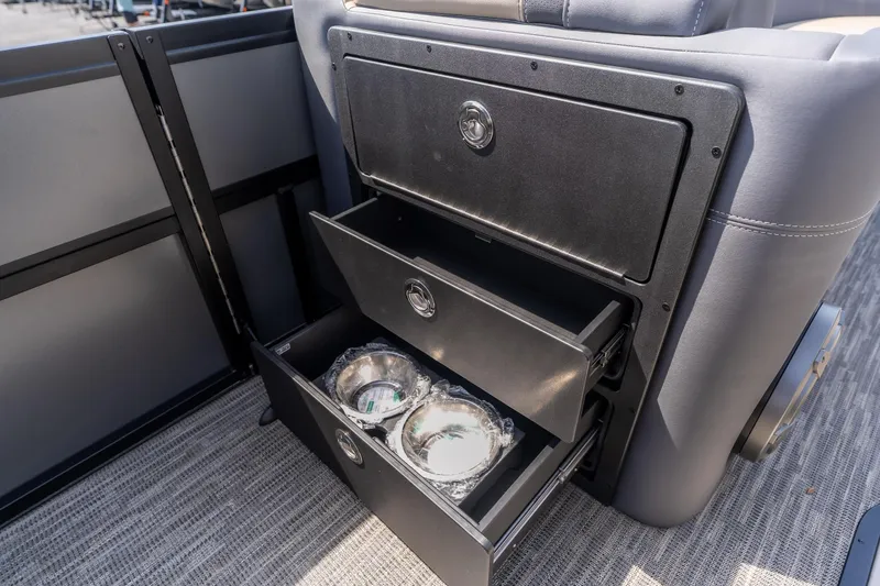 Slide: The Image of Storage compartments with metal bowls in a 2026 Viaggio Z24U boat interior. - 11