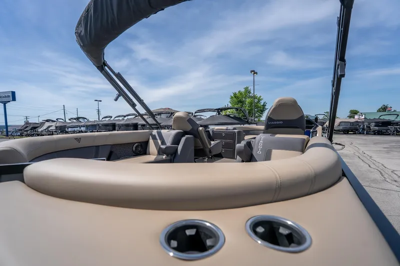 Slide: The Image of 2026 Viaggio Z24U boat interior with beige seating and canopy under blue sky. - 15