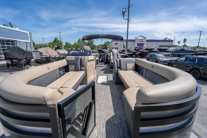 Slide: The Image of 2026 Viaggio Z24U pontoon boat with spacious seating, displayed outdoors. - 5