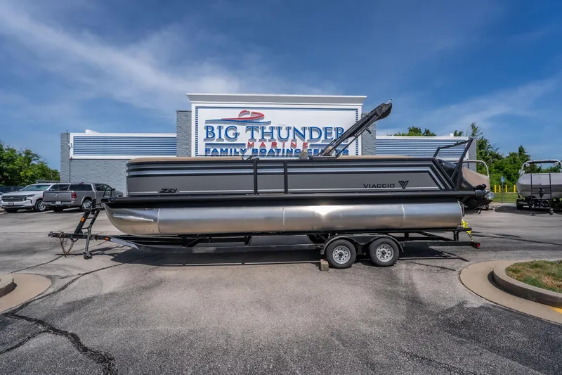 The Image of 2026 Viaggio Z24U pontoon boat on trailer at Big Thunder Marine dealership. - 1