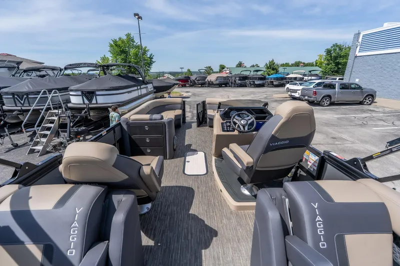 Slide: The Image of 2026 Viaggio Z24U pontoon boat interior with luxurious seating and modern dashboard. - 13