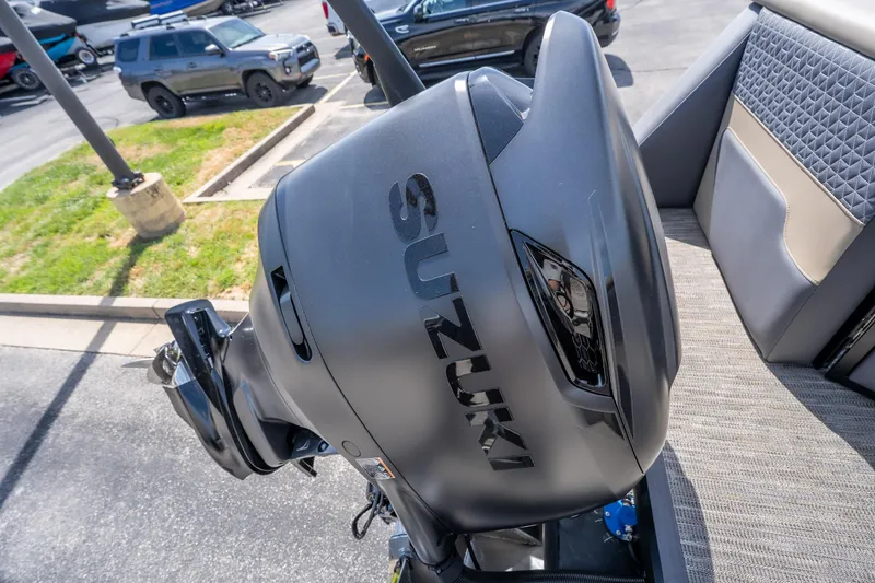 Slide: The Image of Outboard motor on a Viaggio Z24U boat, 2026 model, in a parking lot. - 16