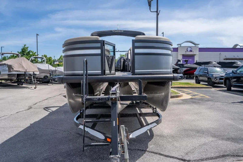 Slide: The Image of 2026 Viaggio Z24U pontoon boat on trailer in dealership parking lot. - 4