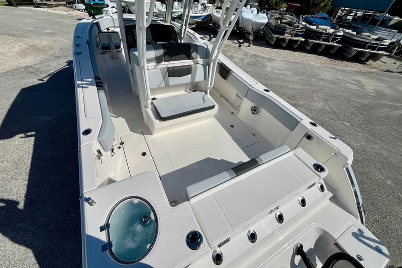Slide: The Image of 2026 Robalo R270 Center Console boat with spacious deck and seating area. - 12