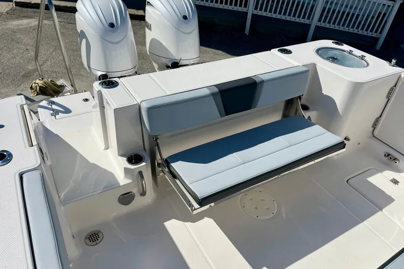 Slide: The Image of 2026 Robalo R270 Center Console boat with dual engines and foldable seating. - 16