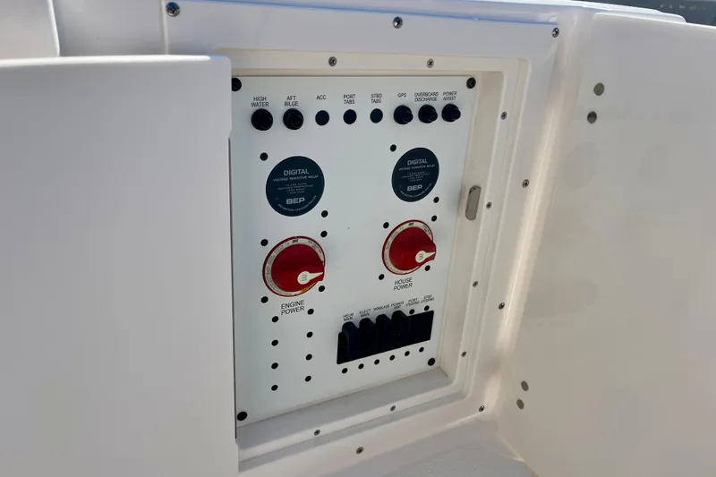 Slide: The Image of Control panel of 2026 Robalo R270 Center Console boat with switches and power controls. - 19