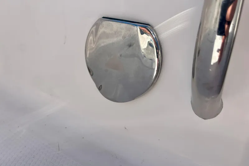 Slide: The Image of Close-up of a metallic fixture on a 2026 Robalo R270 Center Console boat. - 20