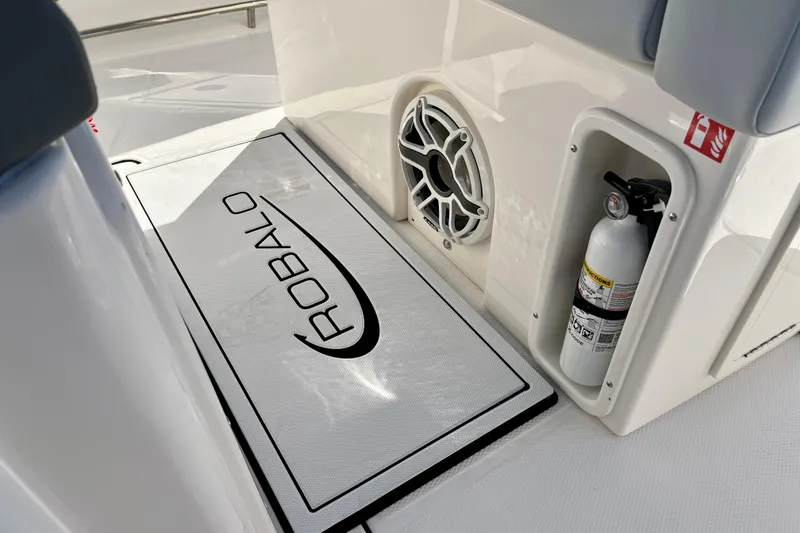 Slide: The Image of 2026 Robalo R270 Center Console boat interior with speaker and fire extinguisher. - 29
