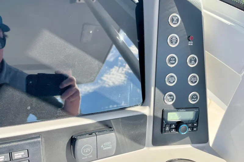Slide: The Image of 2026 Robalo R270 Center Console dashboard with control panel and display screen. - 34