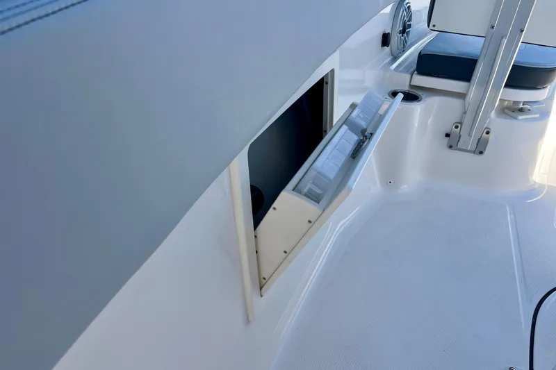 Slide: The Image of 2026 Robalo R270 Center Console boat interior with open storage compartment. - 37