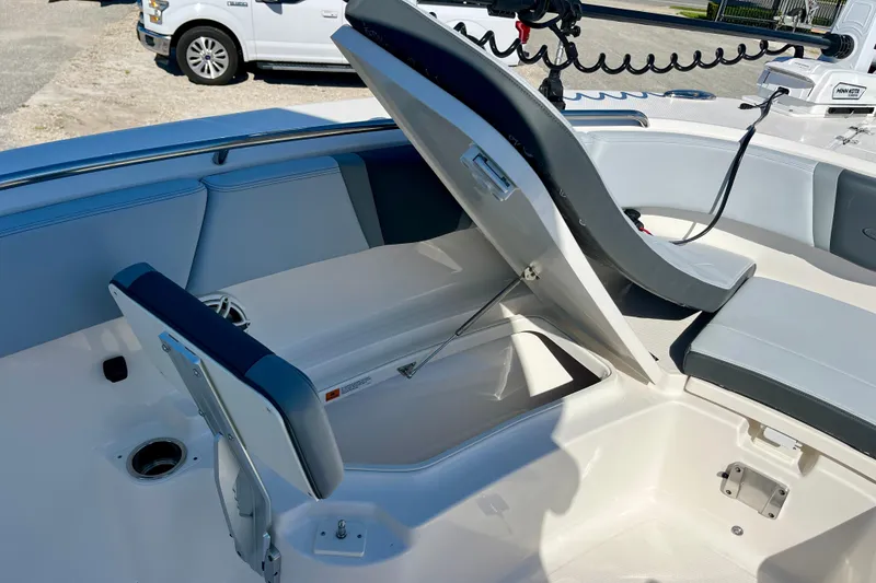 Slide: The Image of 2026 Robalo R270 Center Console boat with open storage compartments and seating. - 39