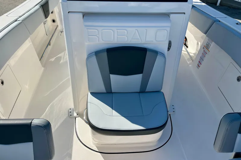 Slide: The Image of 2026 Robalo R270 Center Console boat interior with cushioned seating. - 45