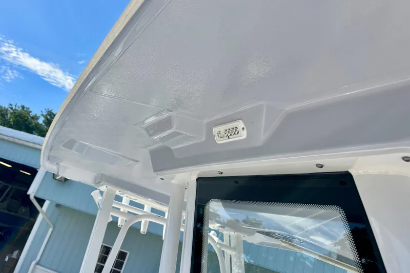 Slide: The Image of 2026 Robalo R270 Center Console boat's sleek white interior roof design. - 50
