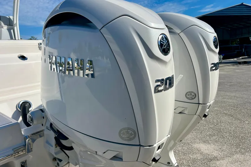 Slide: The Image of Twin Yamaha 200 engines on a 2026 Robalo R270 Center Console boat. - 9