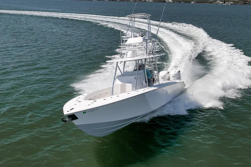 Slide: The Image of 2025 Marquesa 34 boat cruising swiftly on open water. - 3