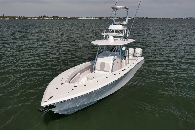 Slide: The Image of 2025 Marquesa 34 boat on open water, showcasing sleek design and modern features. - 30