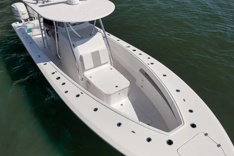 Slide: The Image of 2025 Marquesa 34 boat on water, sleek design, spacious deck, modern features. - 32