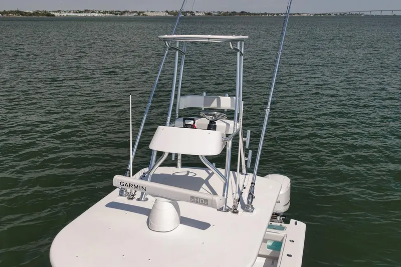 Slide: The Image of Marquesa 34 boat, 2025 model, equipped with Garmin technology, on calm waters. - 33