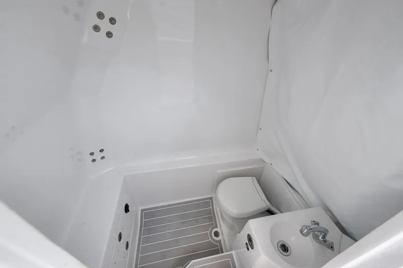 Slide: The Image of Compact bathroom in 2025 Marquesa 34 boat with toilet and sink. - 35