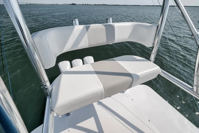 Slide: The Image of Luxury seating on 2025 Marquesa 34 boat, overlooking serene water. - 39
