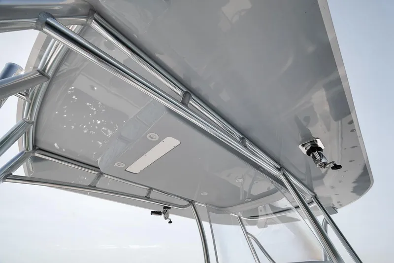 Slide: The Image of 2025 Marquesa 34 boat's sleek overhead structure with polished metal framework. - 44