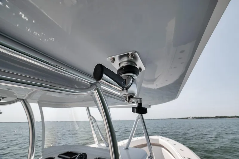 Slide: The Image of 2025 Marquesa 34 boat detail, showcasing sturdy metal framework and ocean backdrop. - 45