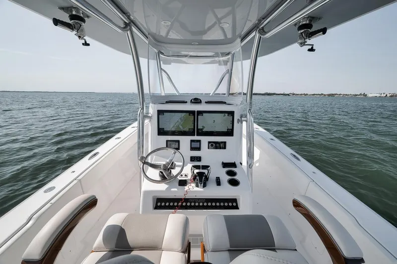 Slide: The Image of 2025 Marquesa 34 boat interior with modern navigation system on open water. - 48