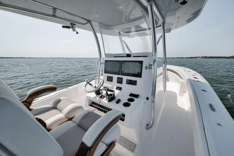Slide: The Image of Modern Marquesa 34 boat interior, 2025 model, featuring advanced navigation systems on open water. - 51