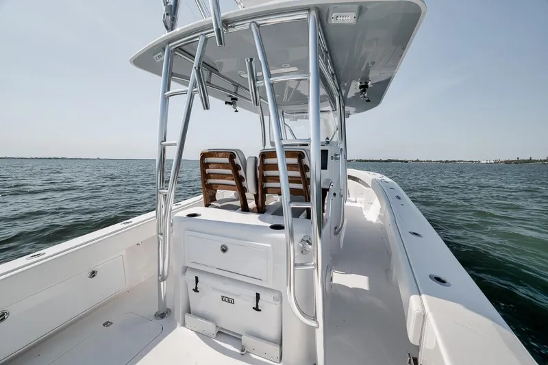 Slide: The Image of 2025 Marquesa 34 boat on open water, featuring sleek design and modern amenities. - 55