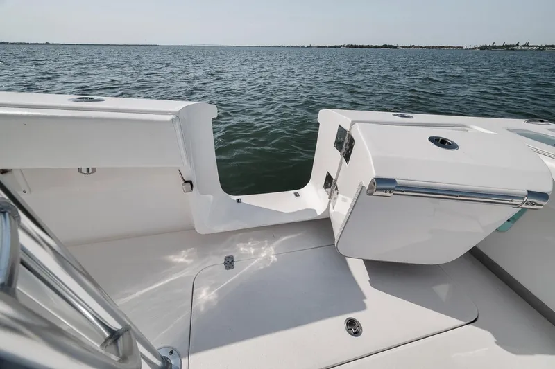 Slide: The Image of 2025 Marquesa 34 boat deck with sleek design, overlooking calm ocean waters. - 58