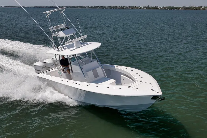 Slide: The Image of 2025 Marquesa 34 boat cruising on open water, showcasing sleek design and powerful performance. - 6